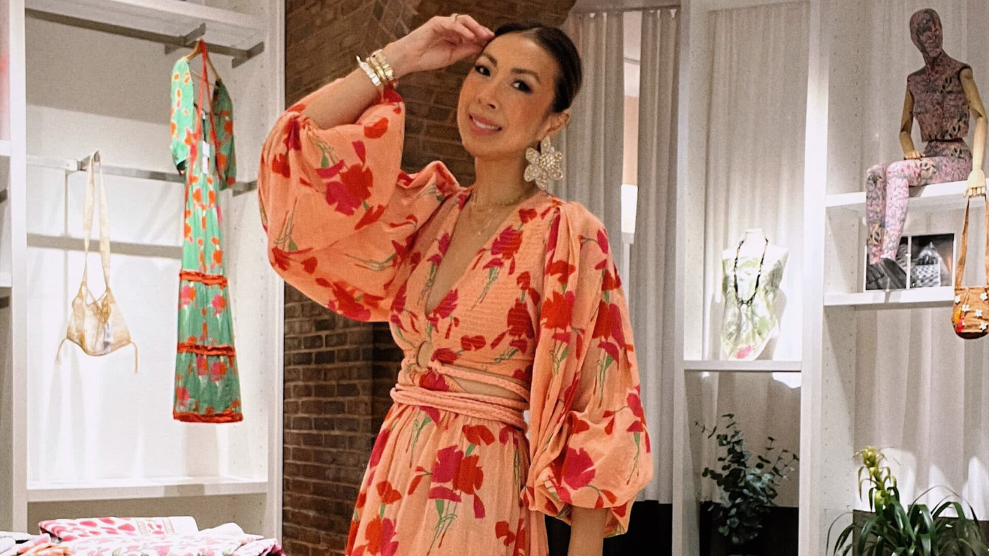 woman waring pink floral beach dress