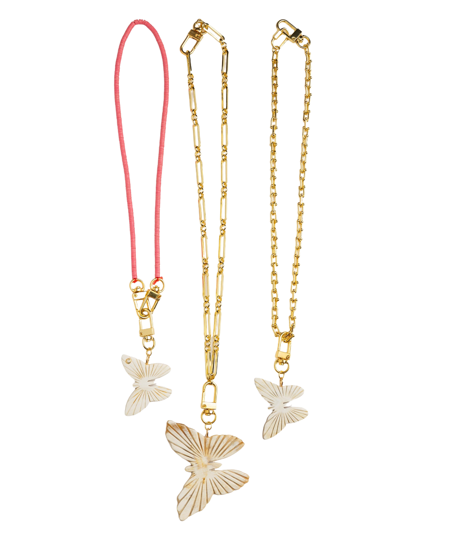 Three gold butterfly necklaces on a white background