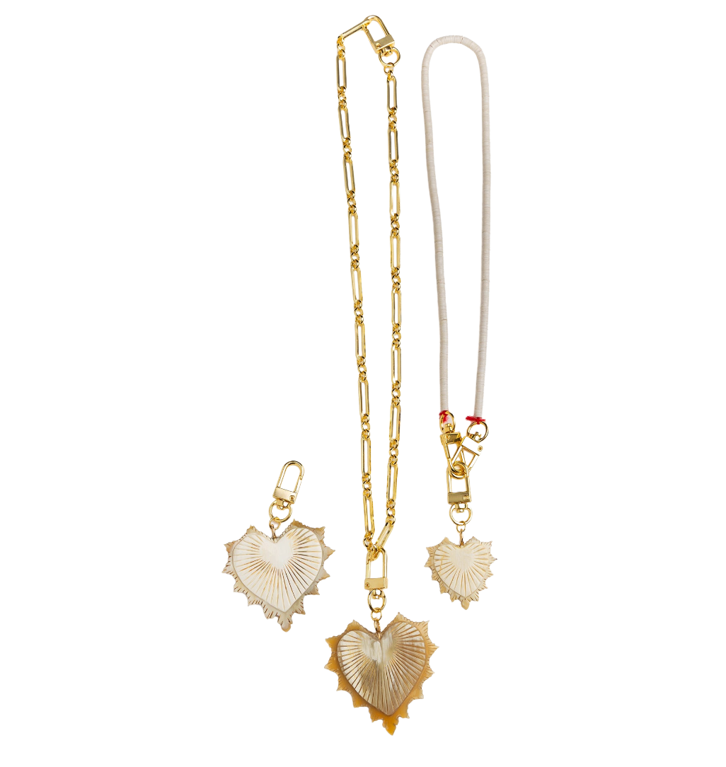 Gold necklace with heart-shaped pendants on a white background