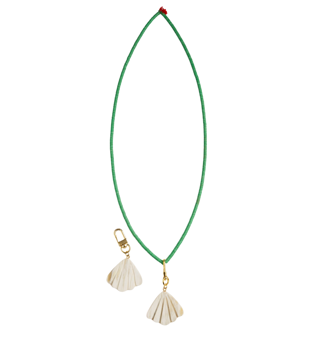 Green necklace with shell pendants on a white background