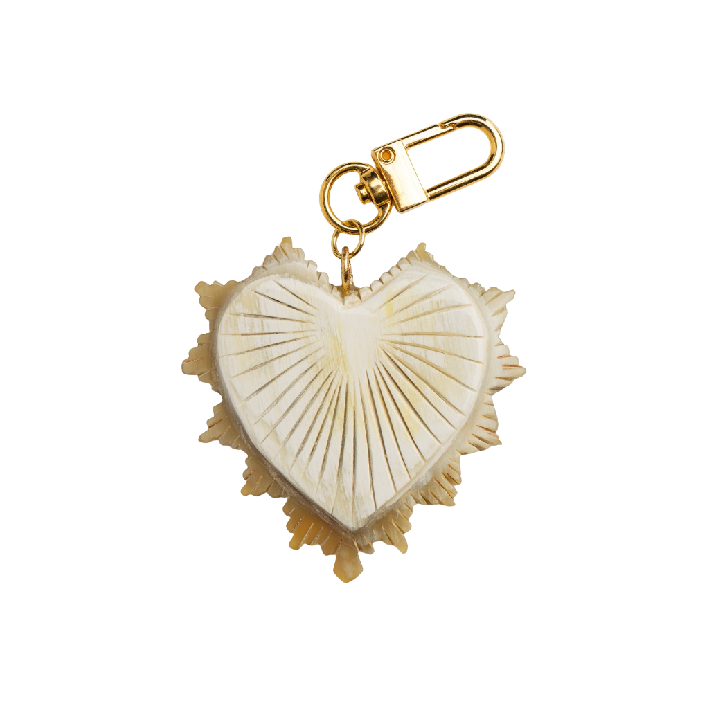 large Heart-shaped charm with gold accents on a white background