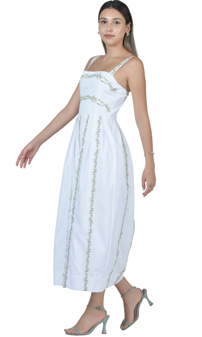 Woman wearing a white dress with gold accents on a white background