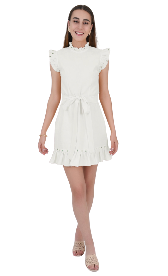 Woman wearing a white dress with ruffled details on a white background