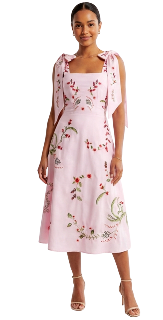 Woman wearing a pink floral dress on a white background