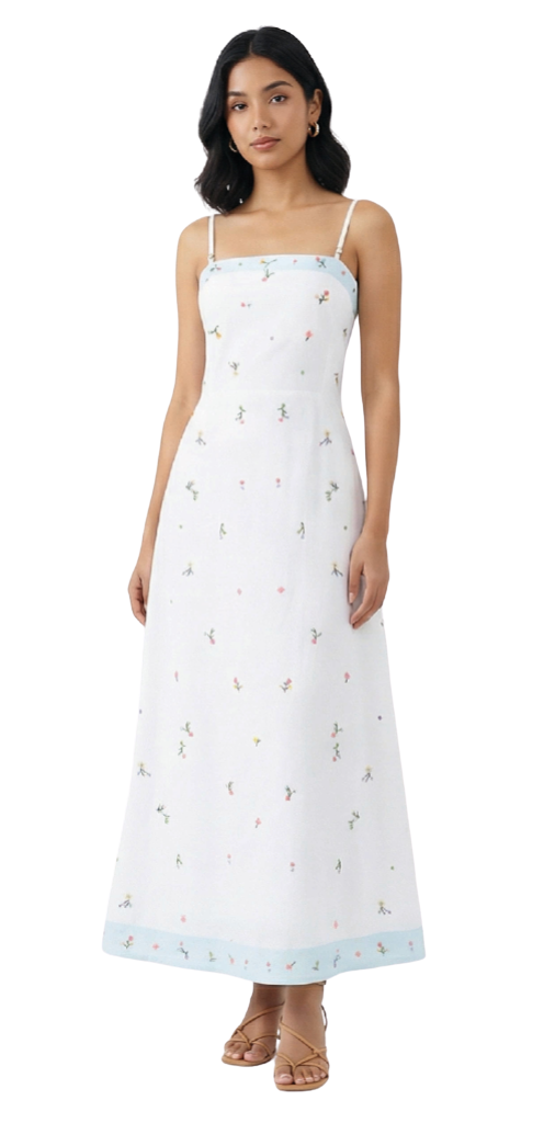 Woman wearing a white dress with floral patterns on a white background