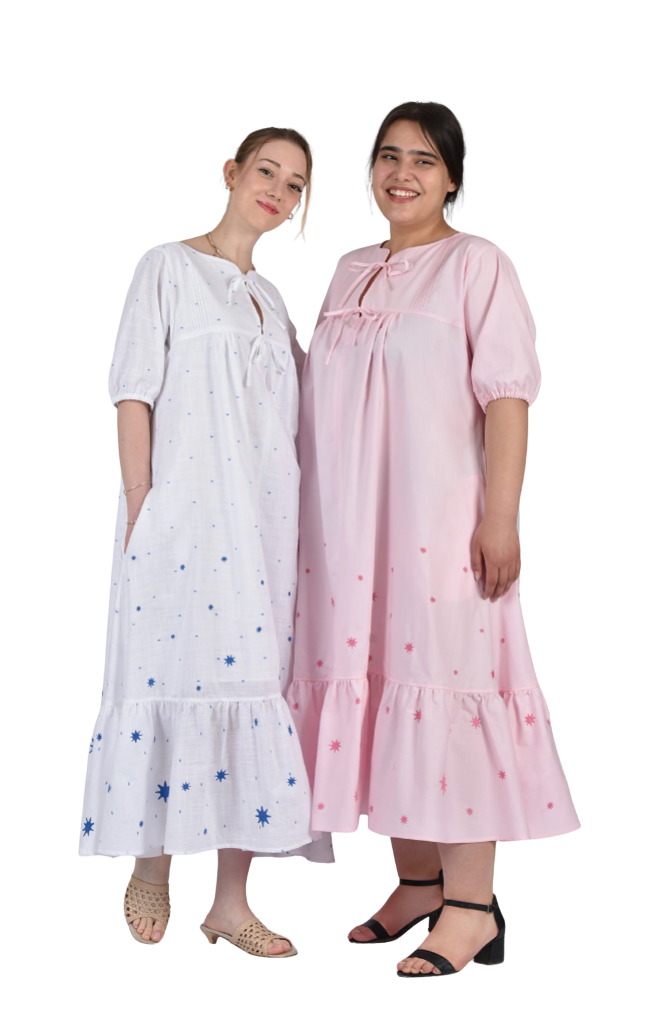 Two women wearing white and pink nightgowns with floral patterns on a white background