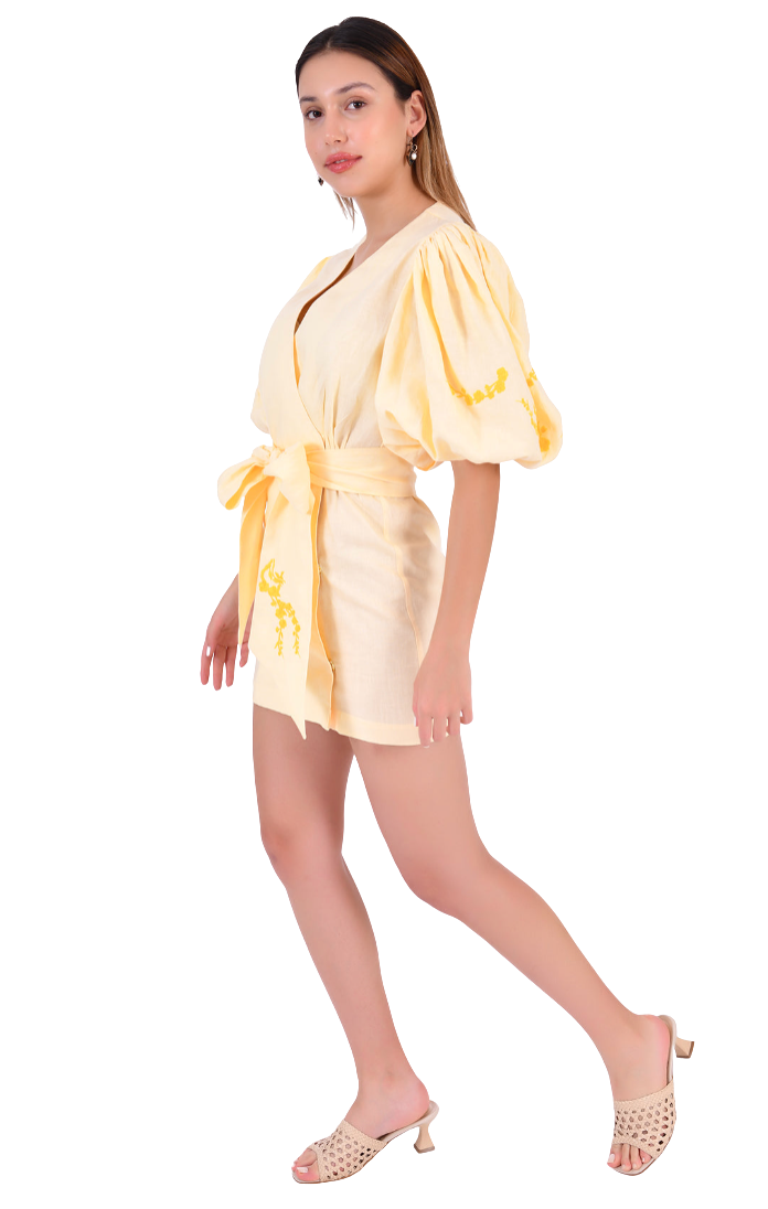 Woman wearing a yellow outfit with a white background