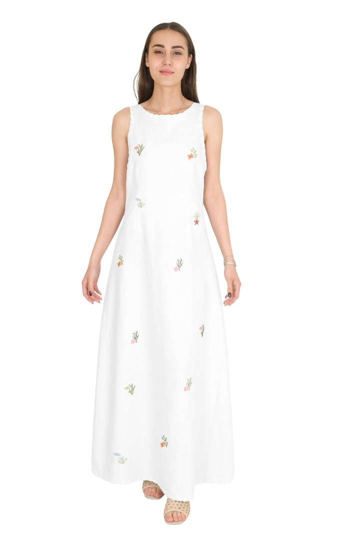 Woman wearing a white embroidered sleeveless dress