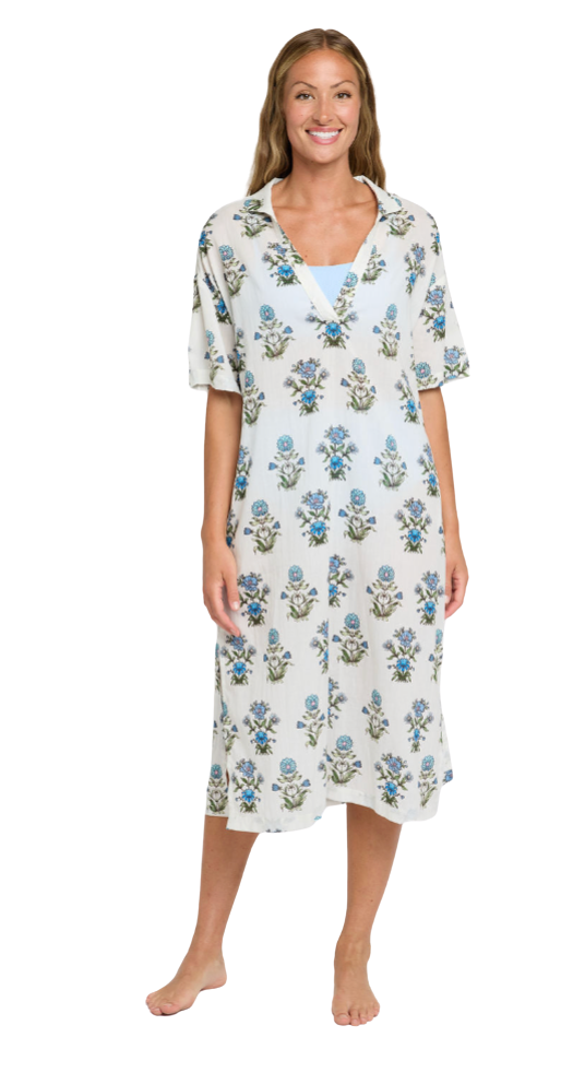 Woman wearing a floral patterned nightgown on a white background
