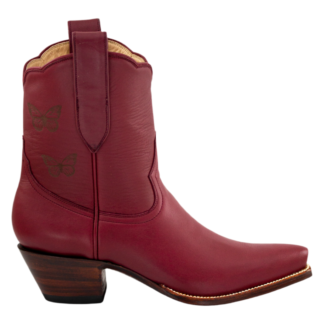 A maroon limited edition midi boot with butterfly engraving and a low heel.
