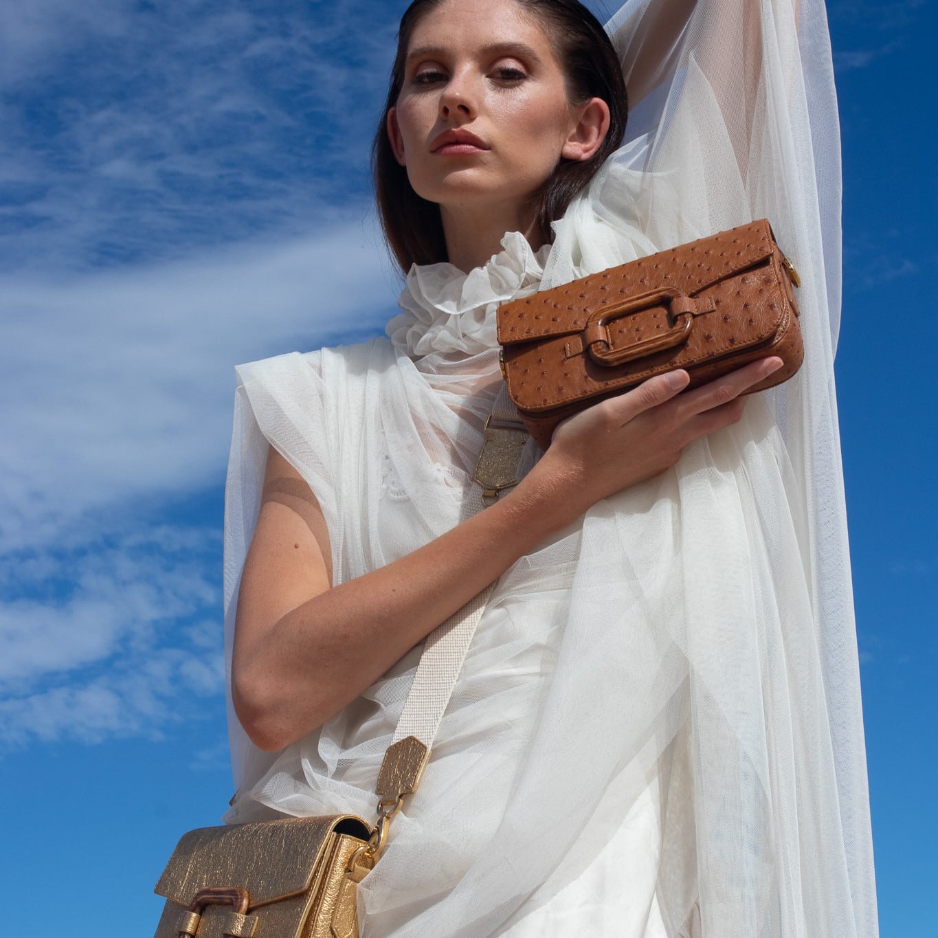Deya Crossbody in Luggage Ostrich with a wood Ring Detail by Cape Cobra