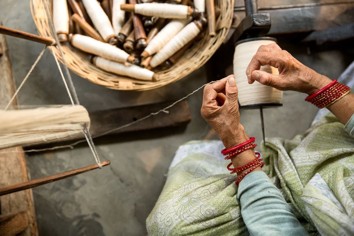 woman weaving herstory