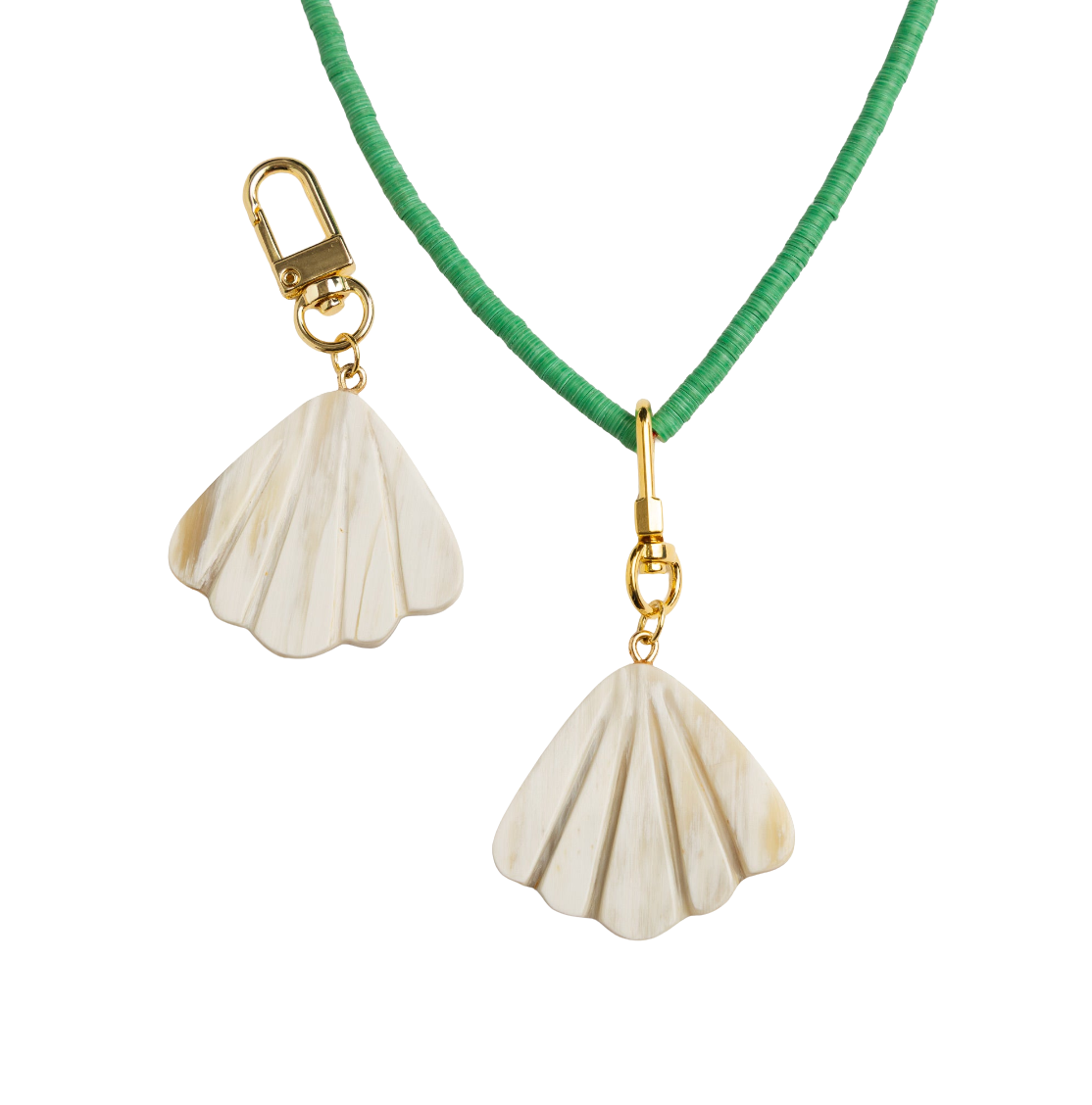 Shell-shaped earrings on a green cord with gold clasps against a white background
