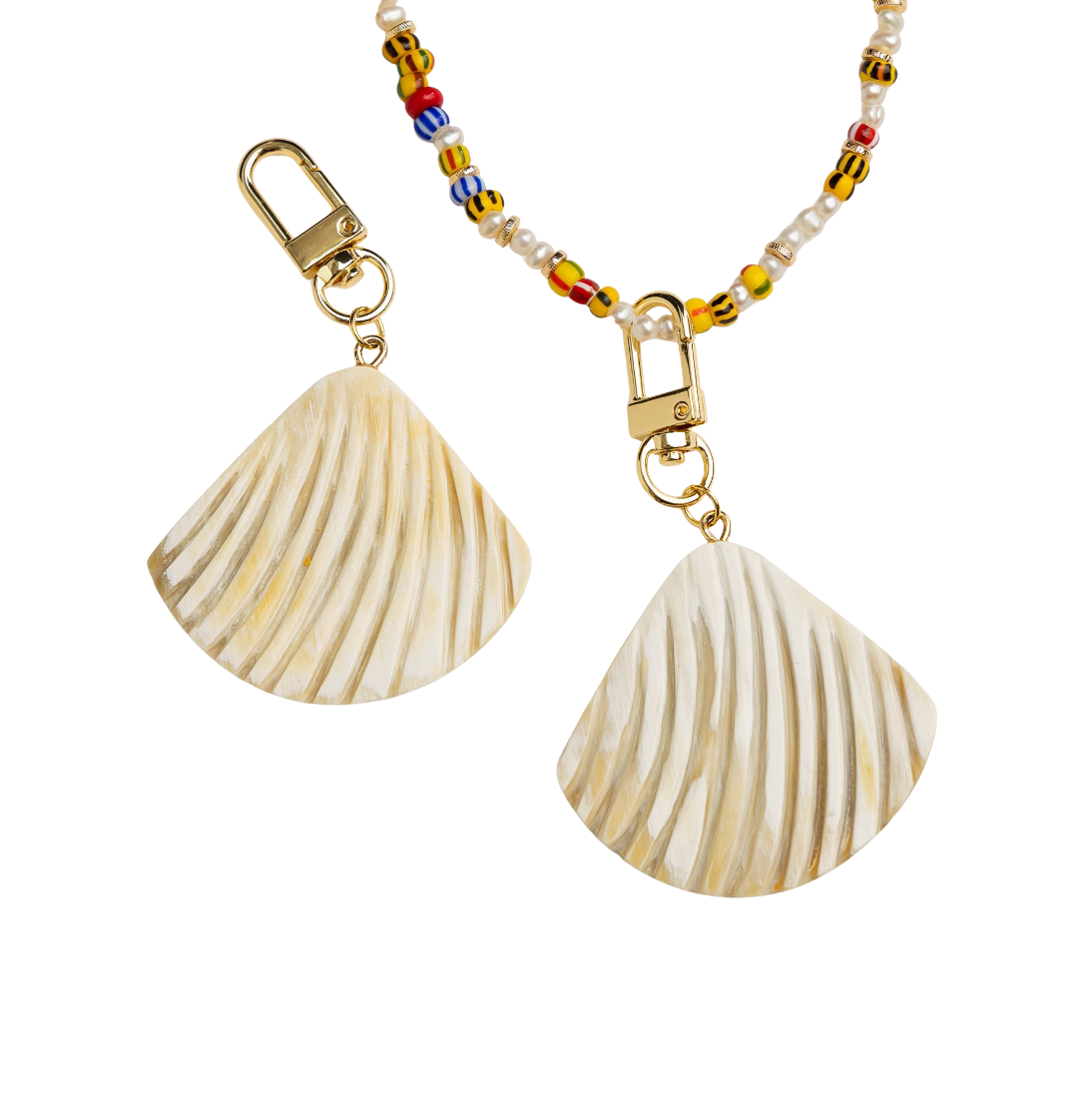 Shell-shaped keychains with a beaded chain on a white background