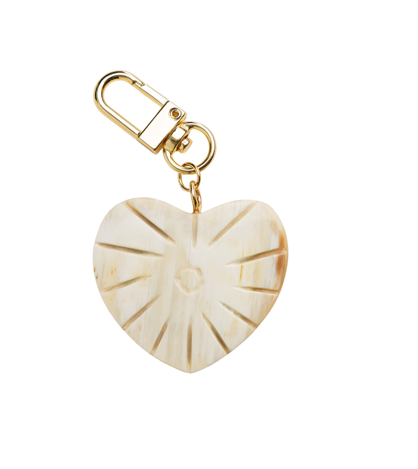 Heart-shaped keychain with gold accents on a white background