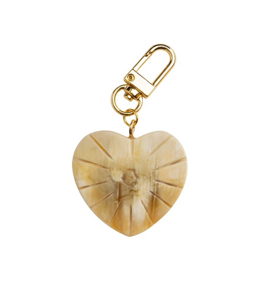 Heart-shaped keychain with gold clasp on a white background