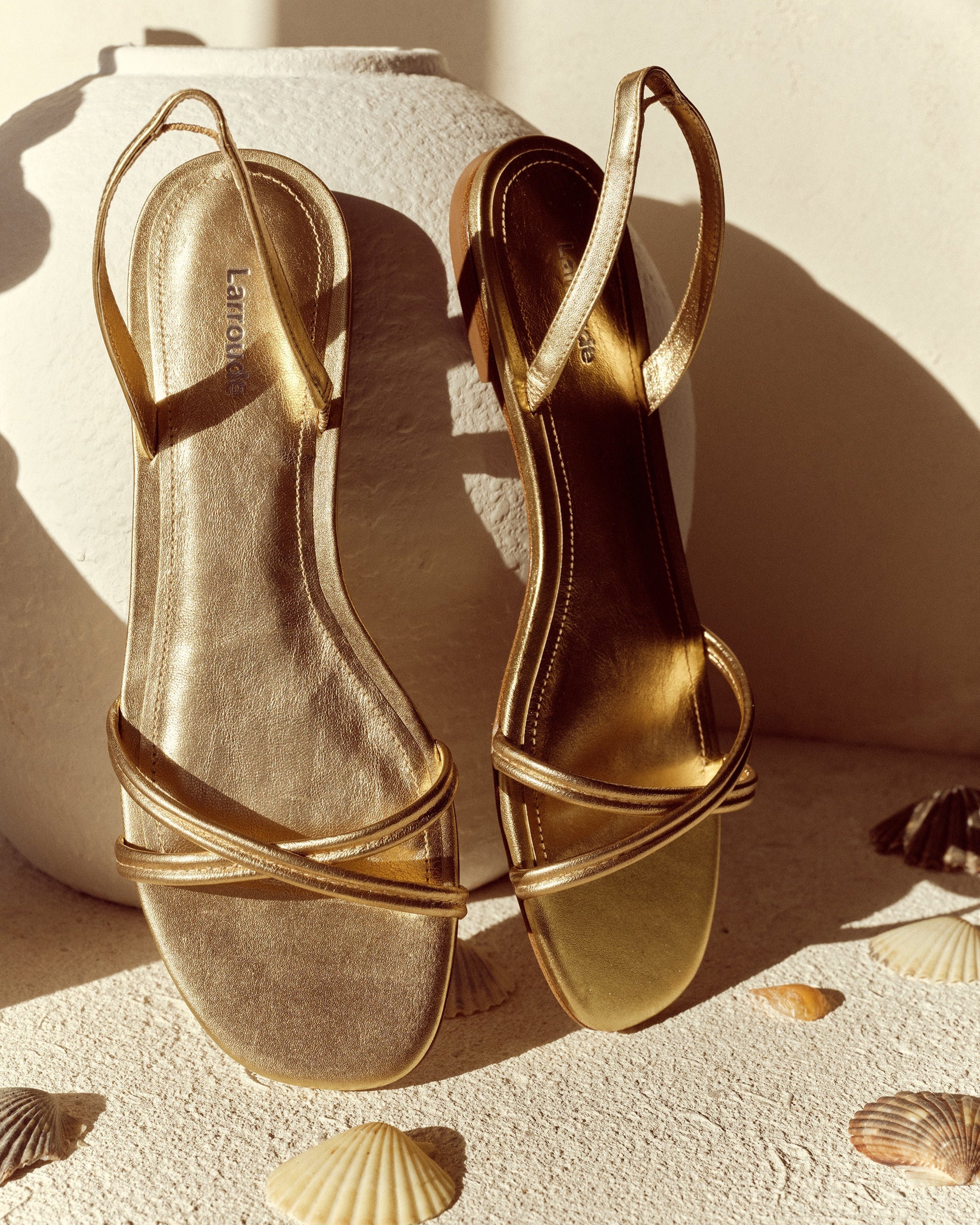 Annie Flat In Gold Metallic Leather by Larroudé