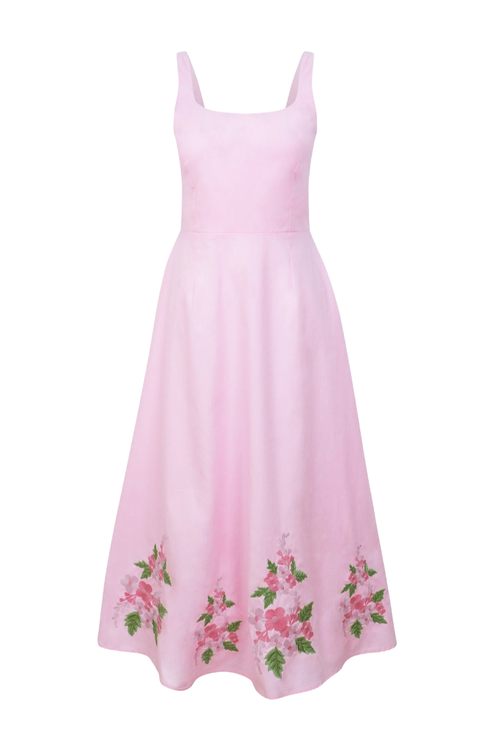 Pink dress with floral embroidery on a white background