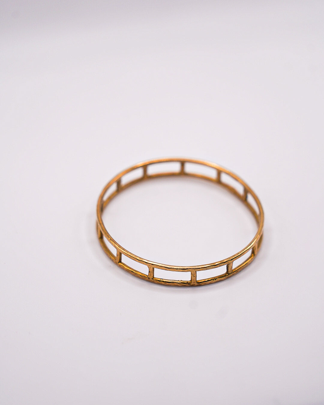 Cage Brass Bangle by Akola