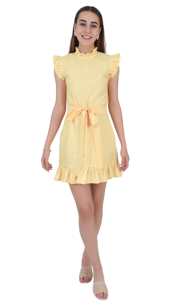 Woman wearing a yellow dress with ruffled sleeves and hem on a white background