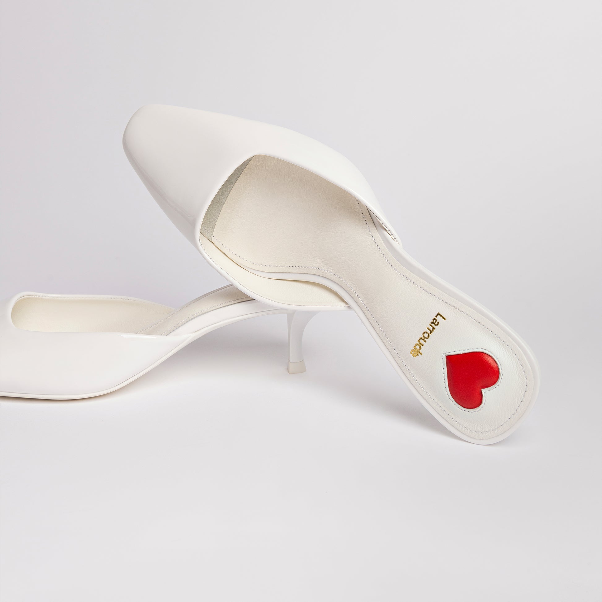 Amal Mule In White Patent Leather by Larroudé