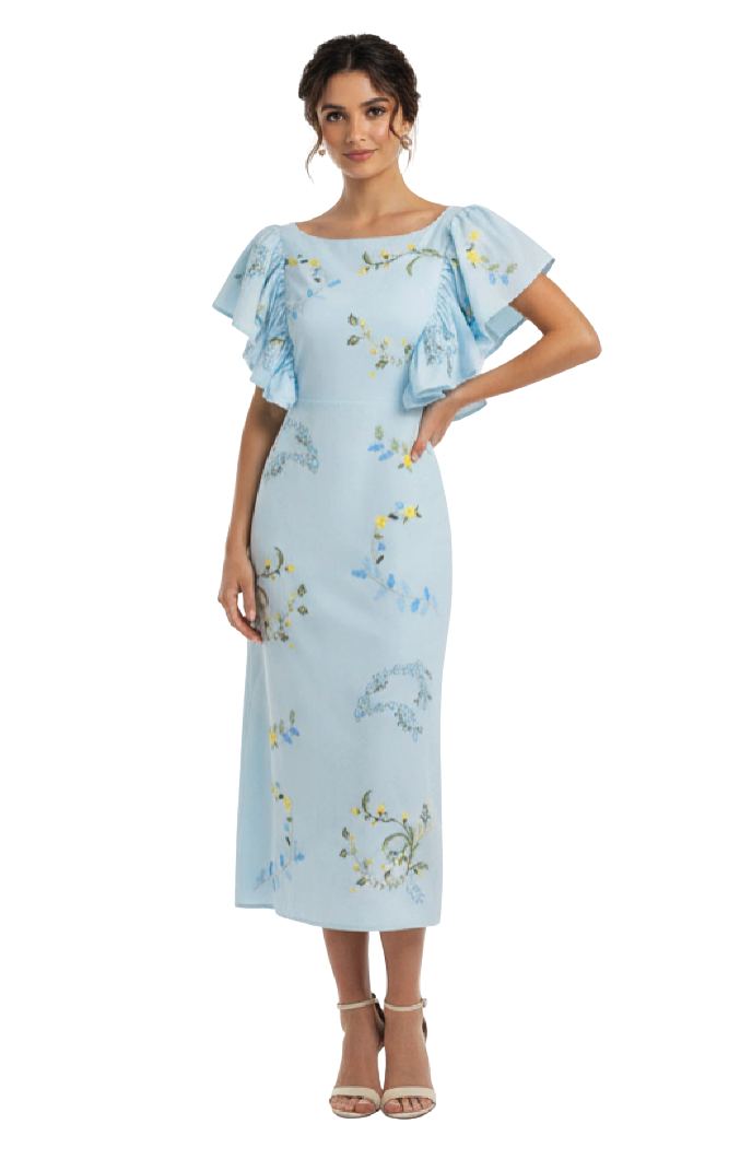 Woman wearing a light blue dress with floral embroidery on a white background