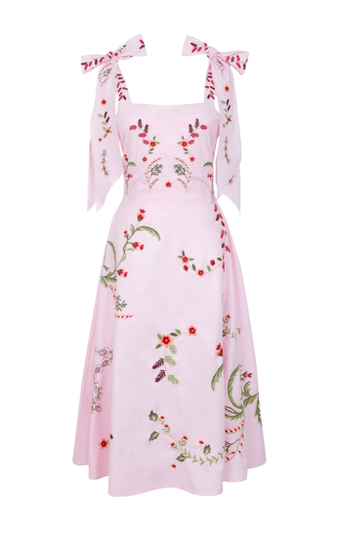 Pink floral dress with bow straps on a white background