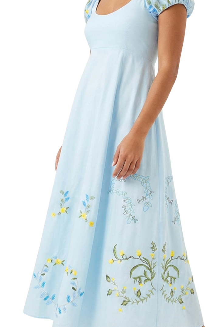 Light blue dress with floral embroidery on a white background