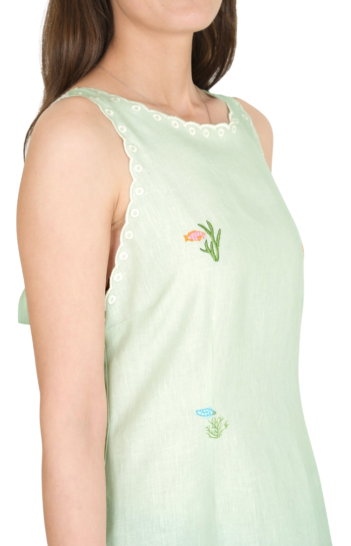 mint green sleeveless top with floral embroidery on a white background