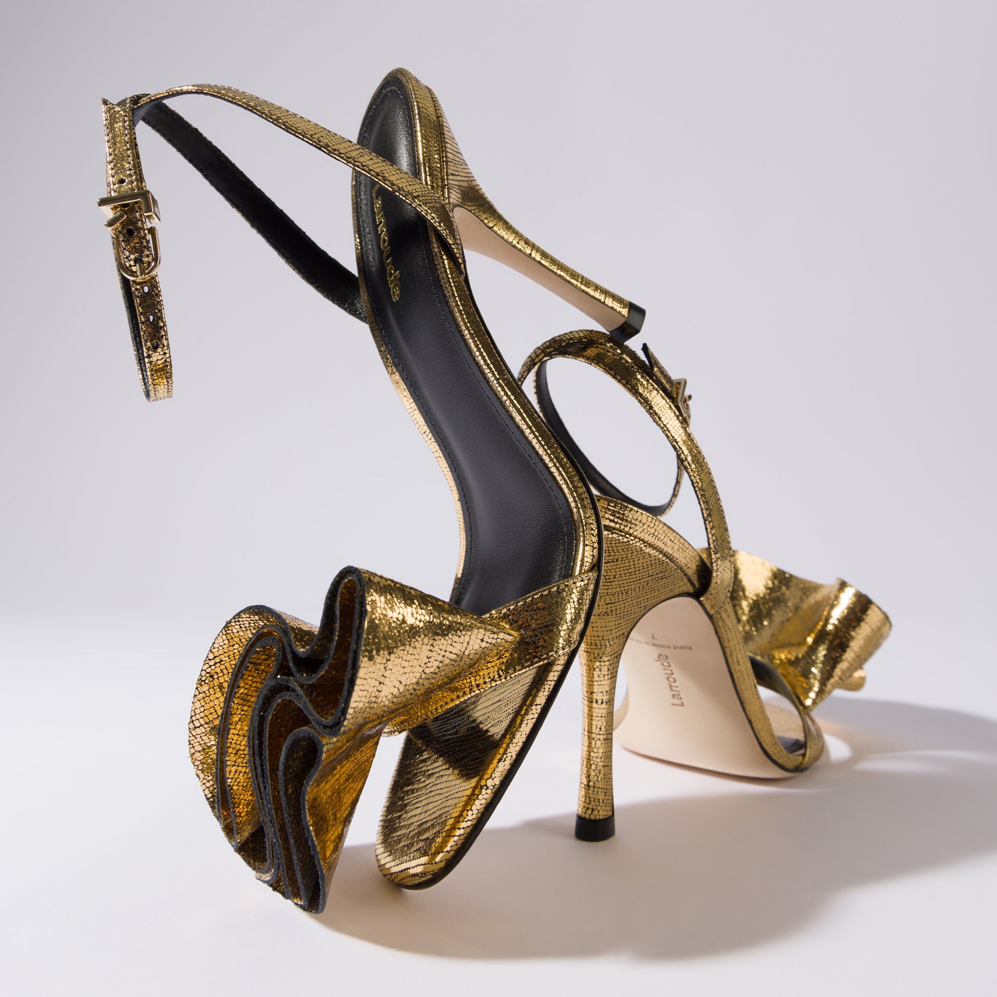 Penelope Sandal In Gold Cracked Metallic Leather by Larroudé