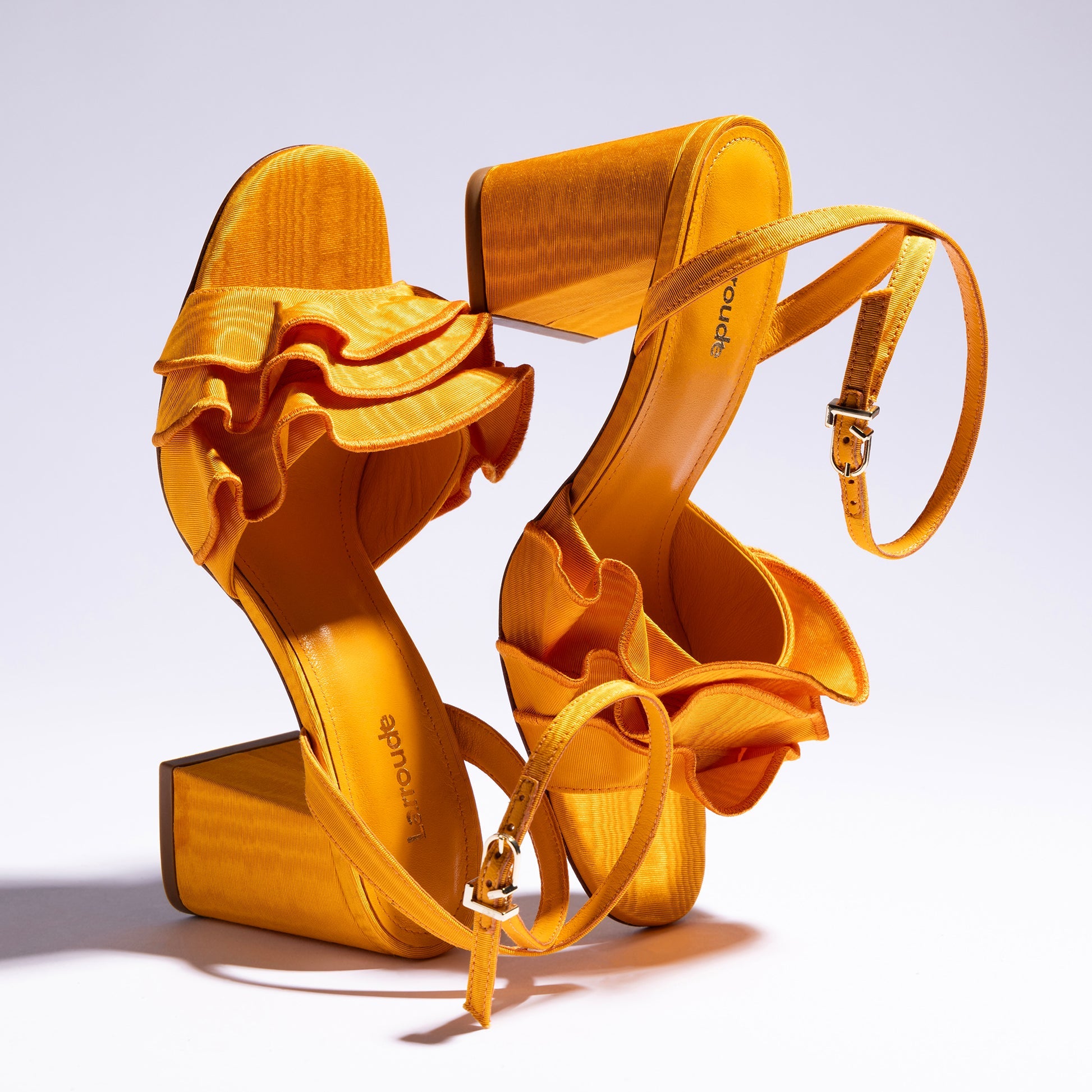 Selena Ruffle Sandal In Mango Fabric by Larroudé