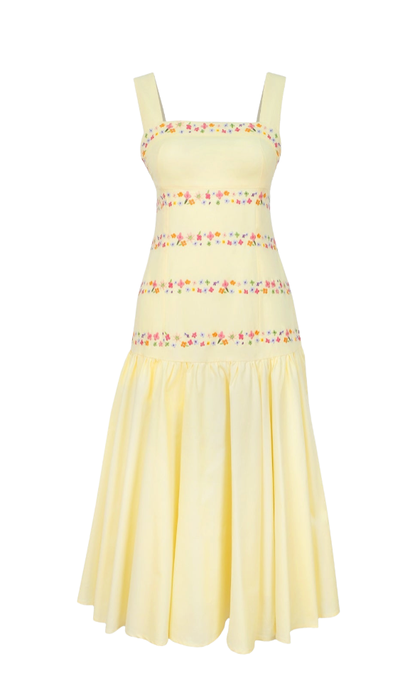 Yellow dress with floral embellishments on a white background