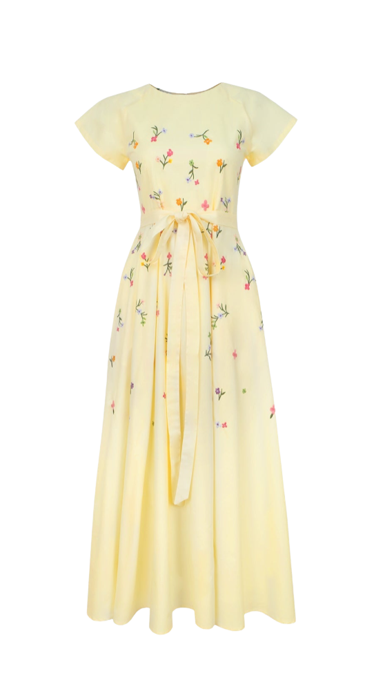 Yellow dress with floral embroidery on a white background