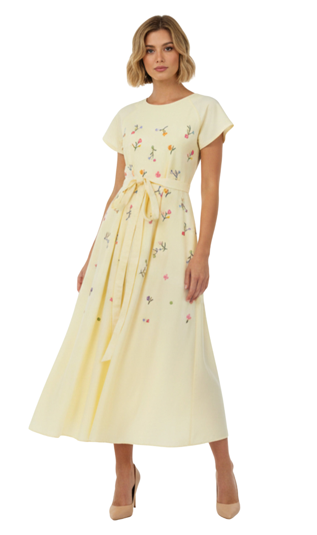 Woman wearing a yellow floral dress on a white background