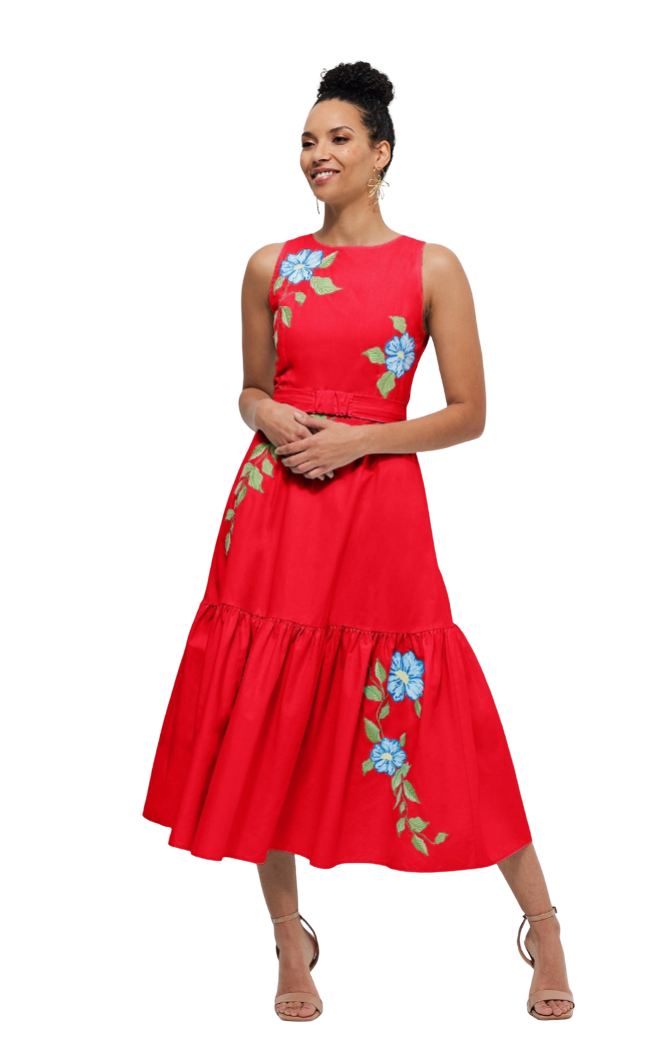 Woman wearing a red dress with floral embroidery on a white background