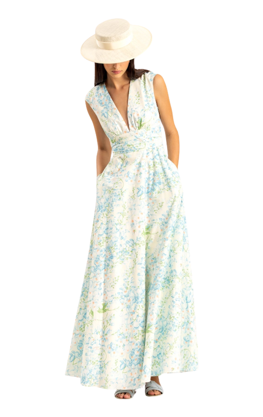 Woman wearing a floral dress and white hat on a white background