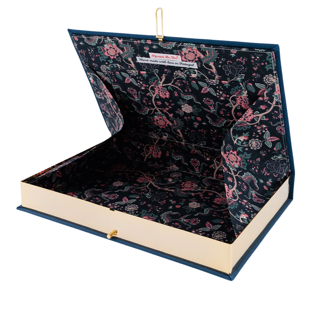 An open book-shaped presentation box with a navy blue floral-patterned interior and cream-colored pages, shown on a white background.