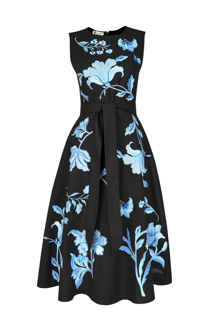 A sleeveless black midi dress with a matching waist tie, featuring a vibrant blue floral and butterfly pattern across the bodice and skirt.