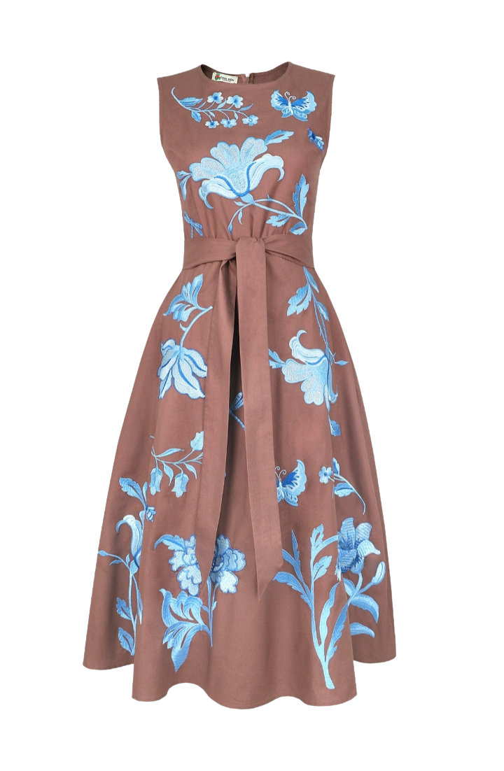 A sleeveless midi dress in a dusty rose-brown color, featuring light blue floral and butterfly embroidery, a matching waist tie, and a flared skirt, shown against a plain white background.
