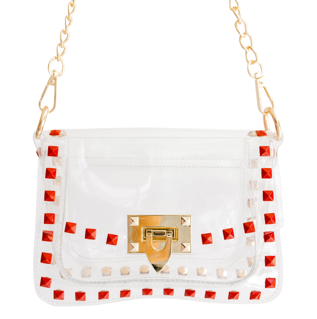 A clear vinyl shoulder bag with a gold-tone chain strap, featuring a gold clasp and a border of red pyramid studs.