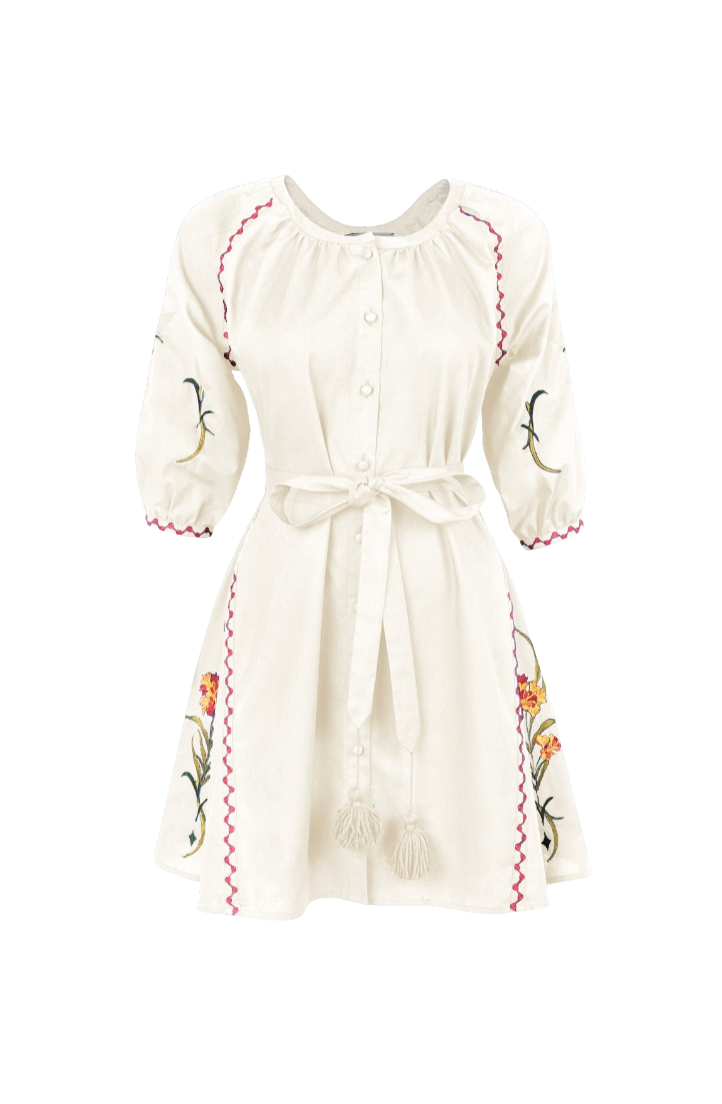 An off-white cotton dress with floral embroidery, featuring a button-up front, 3/4 sleeves, a tie waist, and decorative pink zigzag stitching along the seams.