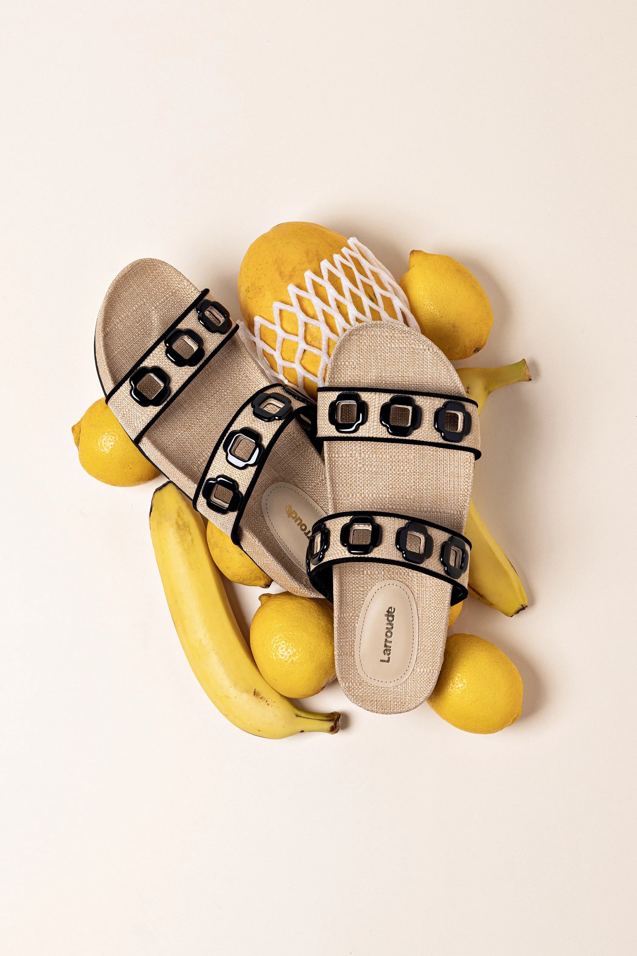 Milan Slide In Beige Raffia and Black Trimming by Larroudé