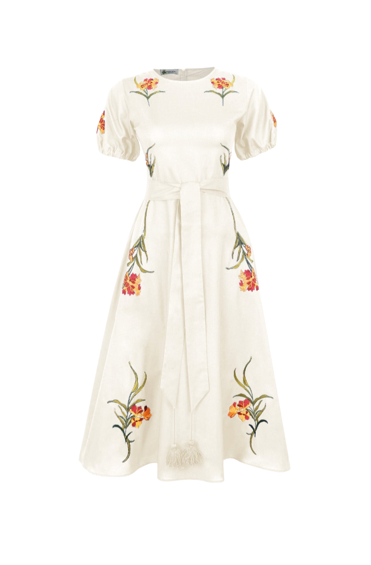 An off-white midi dress with short puff sleeves, a matching waist tie, and colorful floral embroidery in red, orange, and green, shown against a plain white background.
