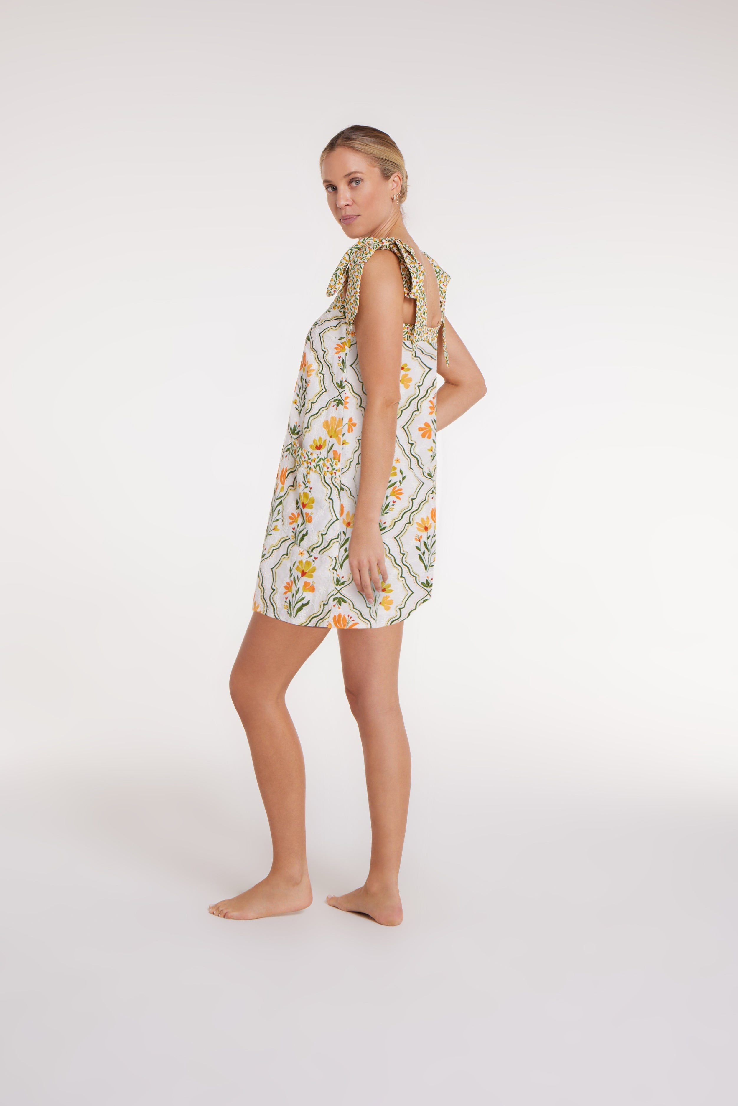 Hillary Bow Tie Mini Dress in Tile Floral by Hermoza