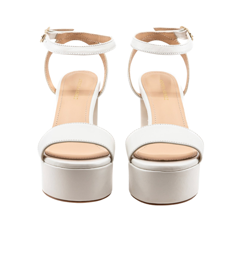 White platform sandals with beige soles on a white background