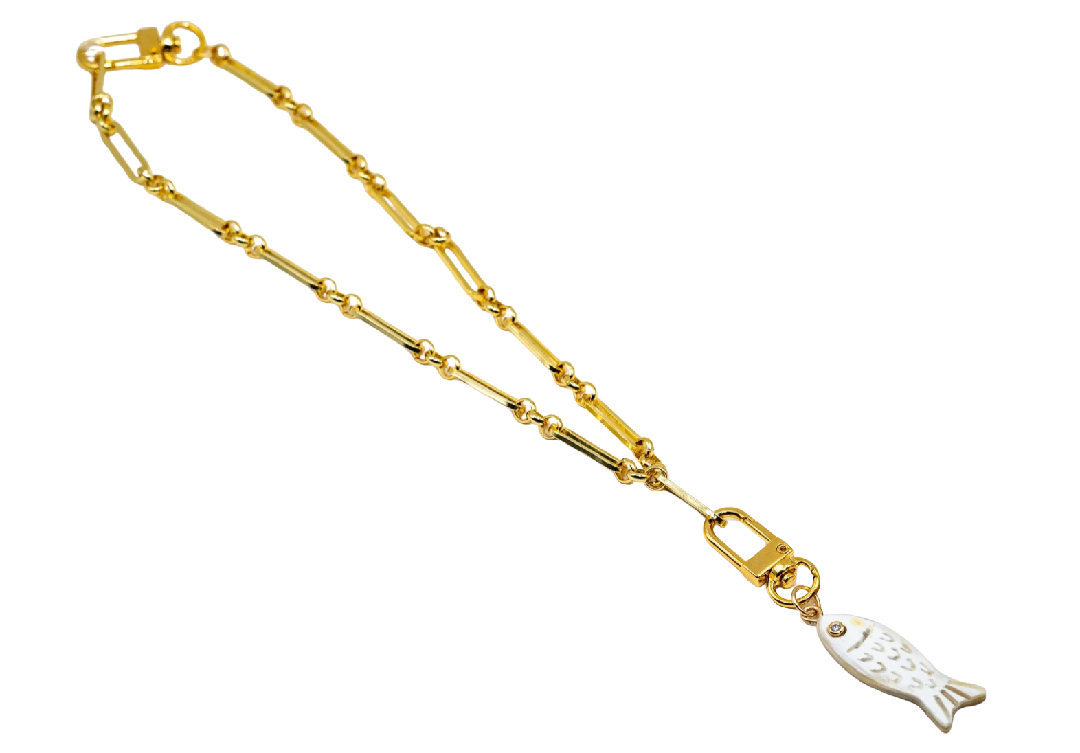 A gold chain necklace featuring a silver-colored fish-shaped pendant, displayed on a clean white background.