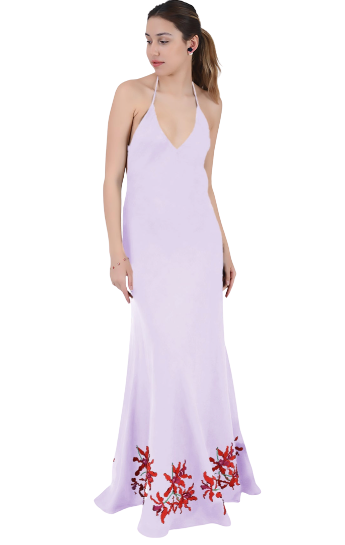 Woman wearing a lavender dress with red floral embroidery on a white background