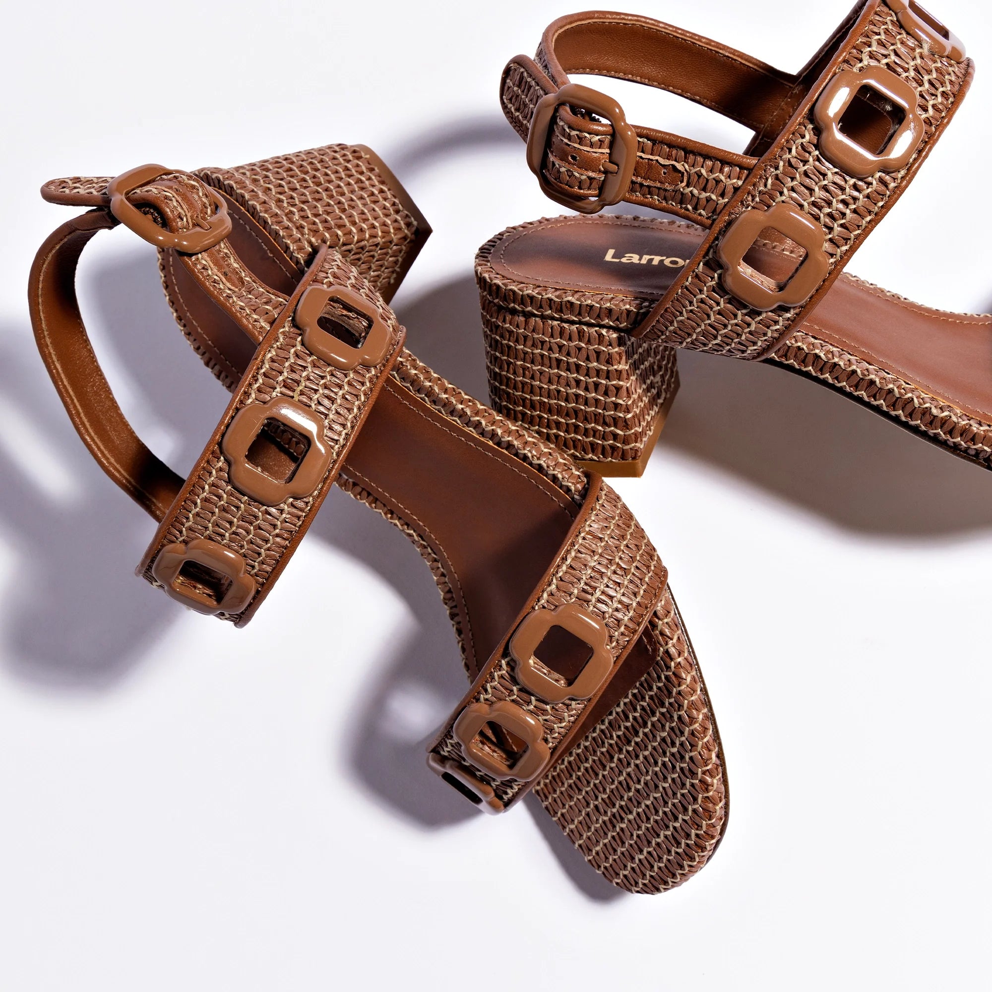 Milan Sandal In Caramel Wave Raffia by Larroudé