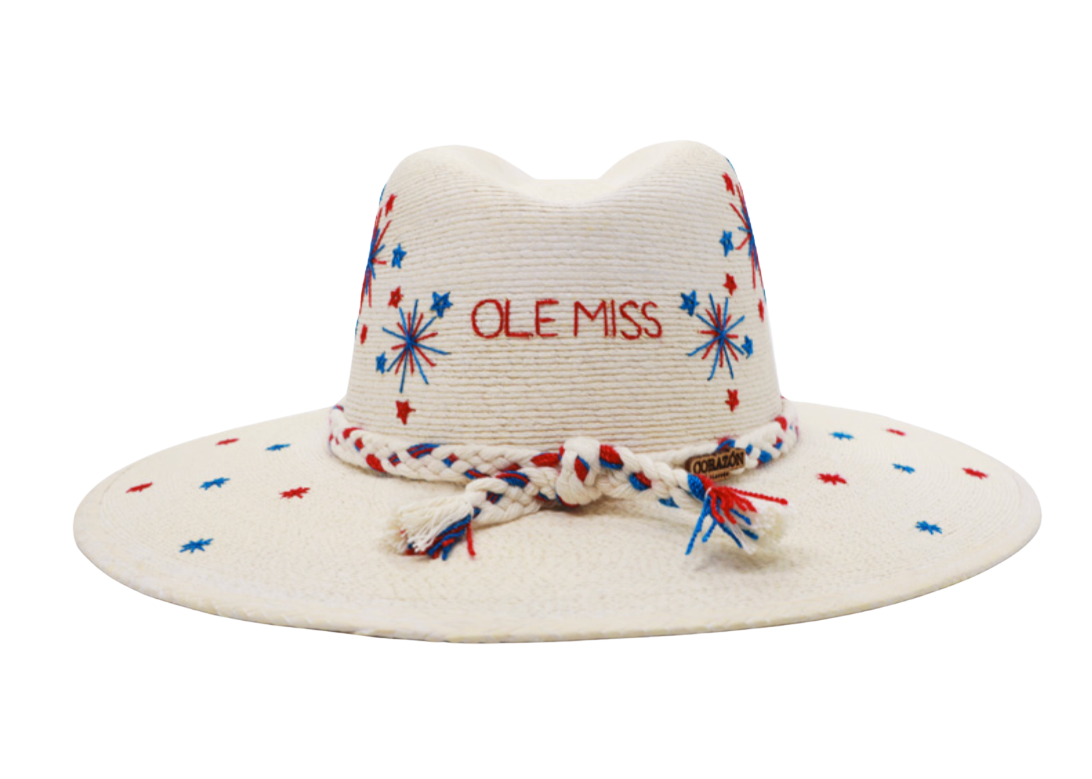 An off-white woven straw hat with embroidered red and blue starburst patterns, featuring 'OLE MISS' embroidered in red on the front. It has a braided rope band in red, white, and blue with tassels, and a small wooden brand tag.