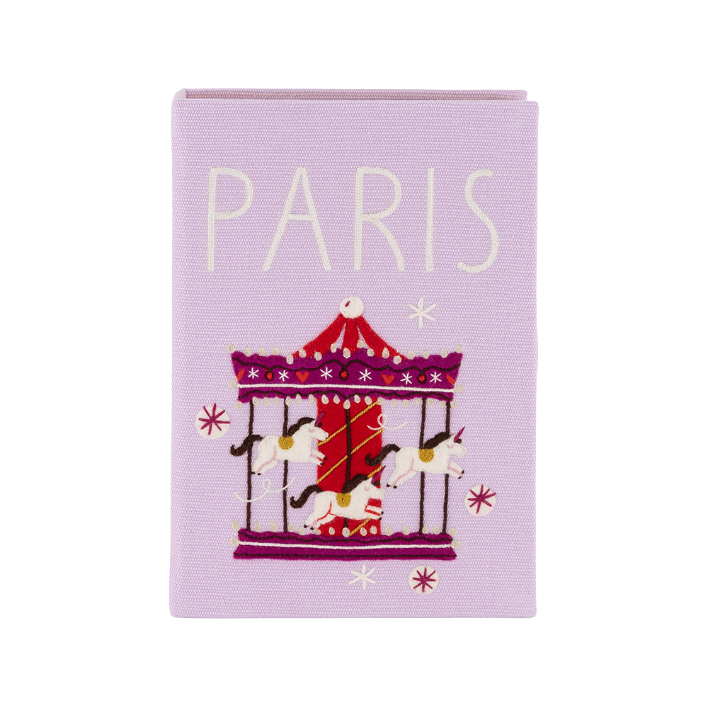 Purple notebook with a carousel illustration and 'PARIS' text on a white background